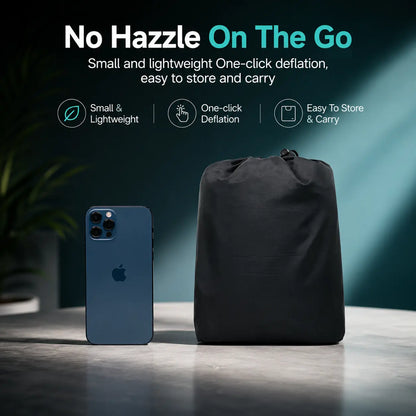 Deflated air seat cushion packed in small carry pouch next to smartphone for size comparison