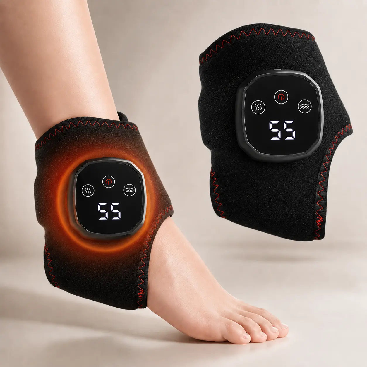 Black cordless heated ankle and wrist massager wrap with LED display, worn on the ankle