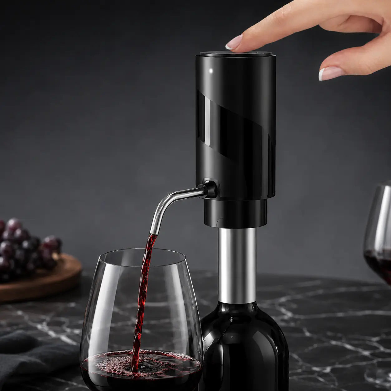 One-touch electric wine dispenser aerating and pouring red wine into stemless glass