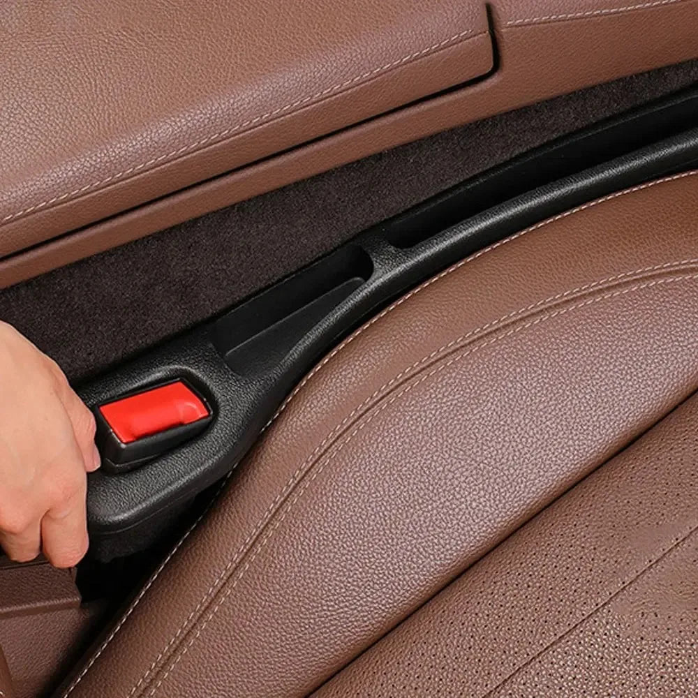 Car seat gap fillers installed between the seats of a beige car interior