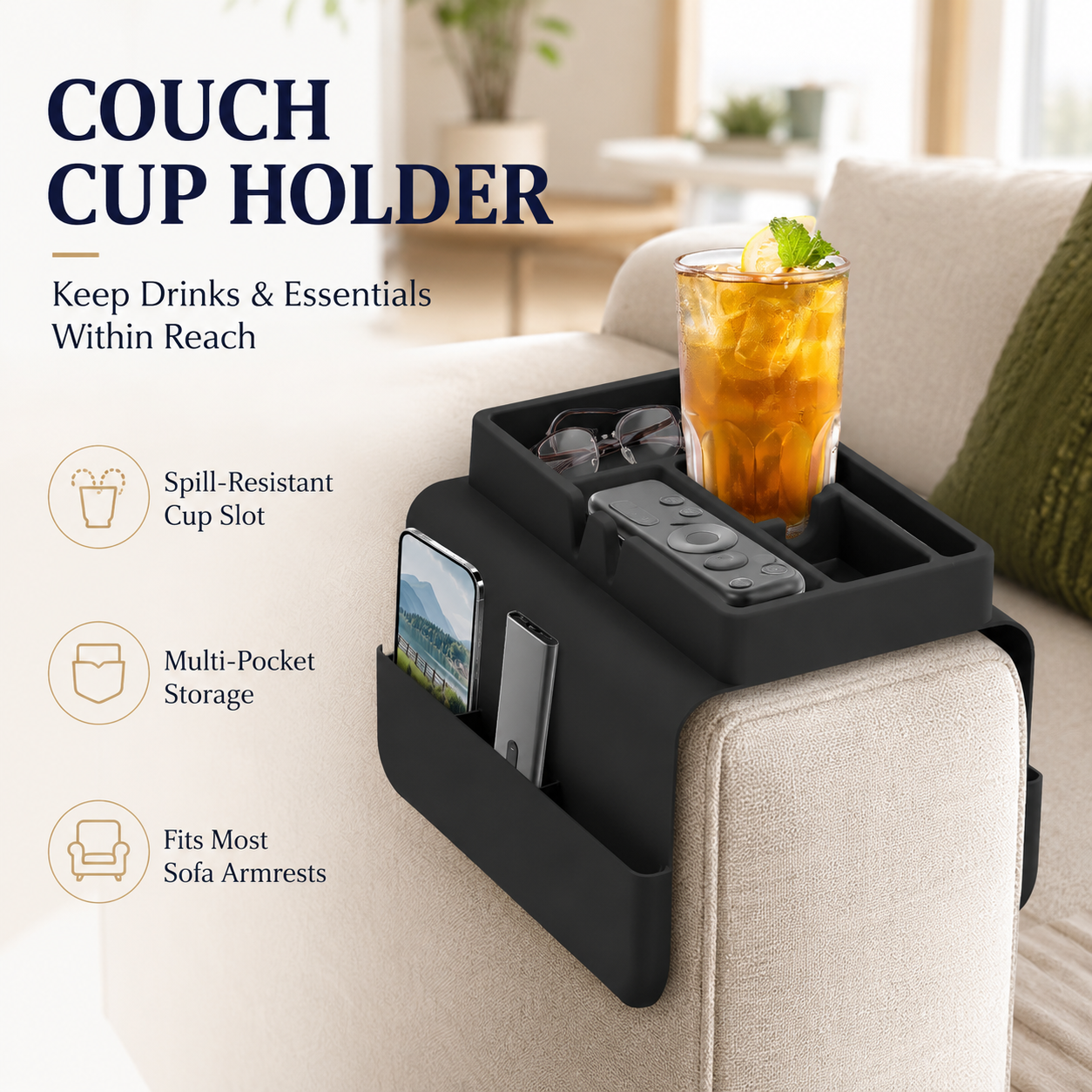 Black silicone couch cup holder on sofa armrest holding iced tea, phone, remote and glasses — spill-resistant cup slot and multi-pocket storage organizer.